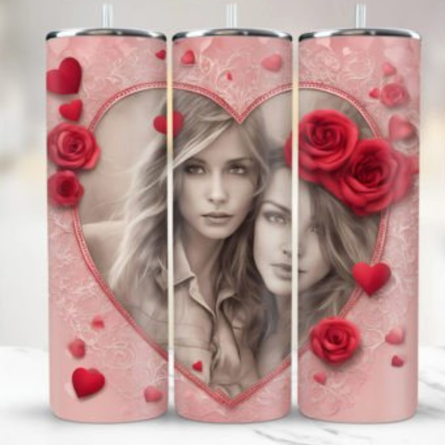 Three tumblers with a design of a woman's face, red roses, and hearts on a pink background.