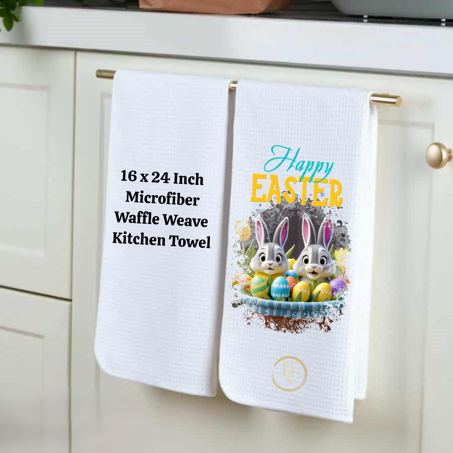 Two kitchen towels hanging on a cabinet handle, one with text and the other with an Easter design.