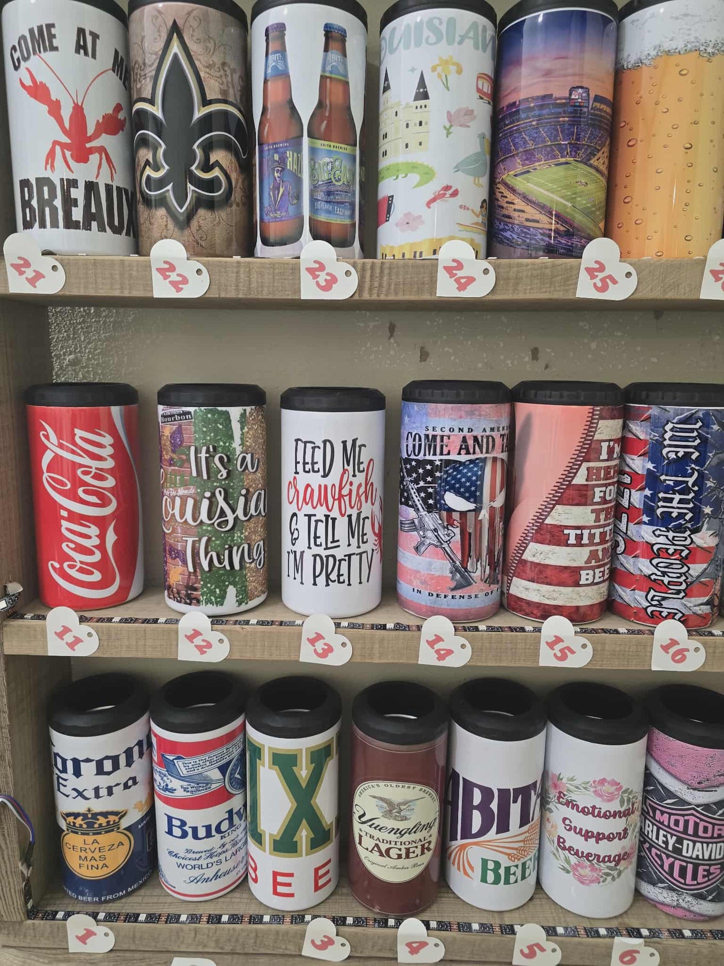 Shelf displaying various branded canisters with different designs and text.