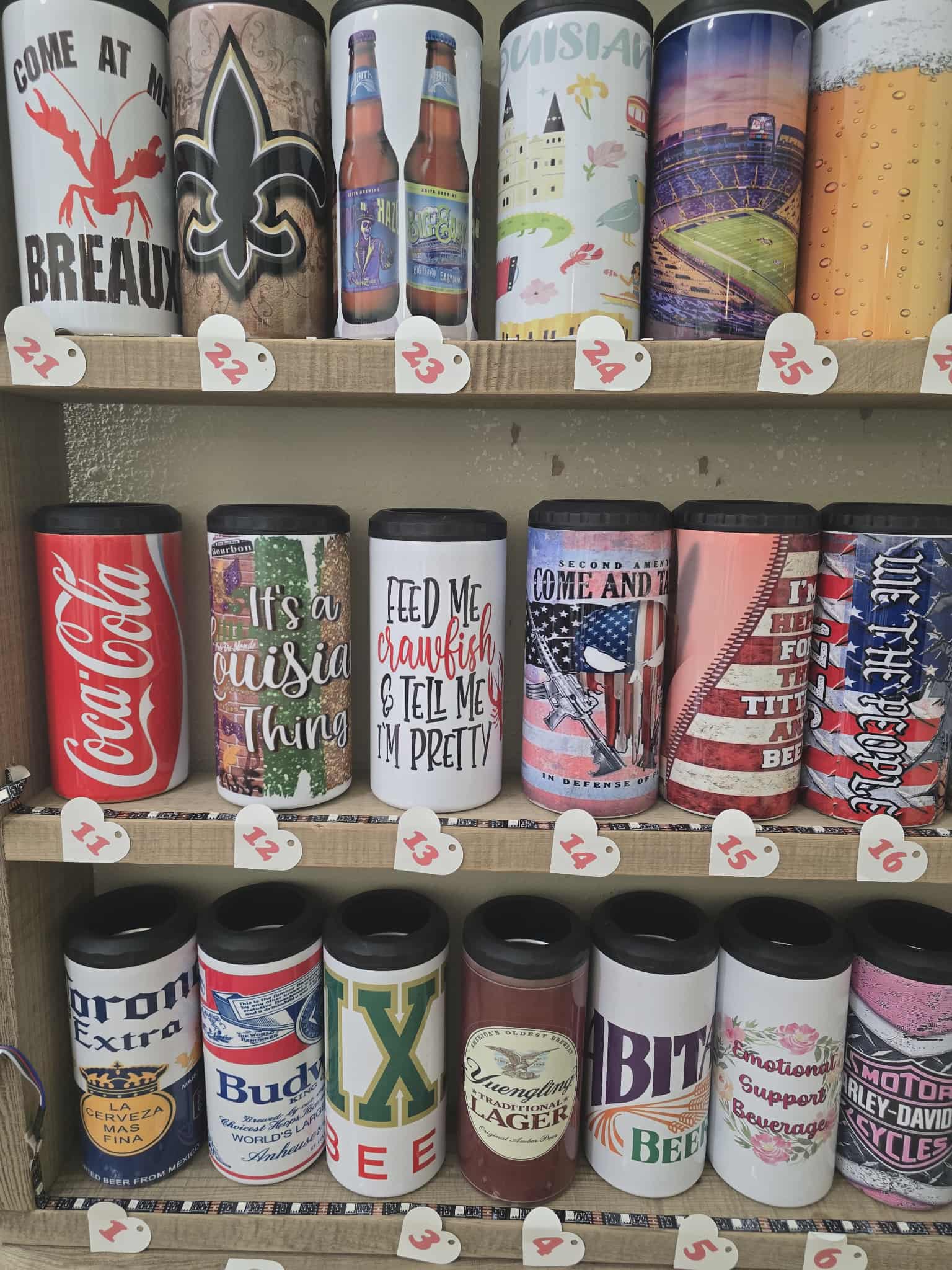 Shelf displaying various branded canisters with different designs and text.