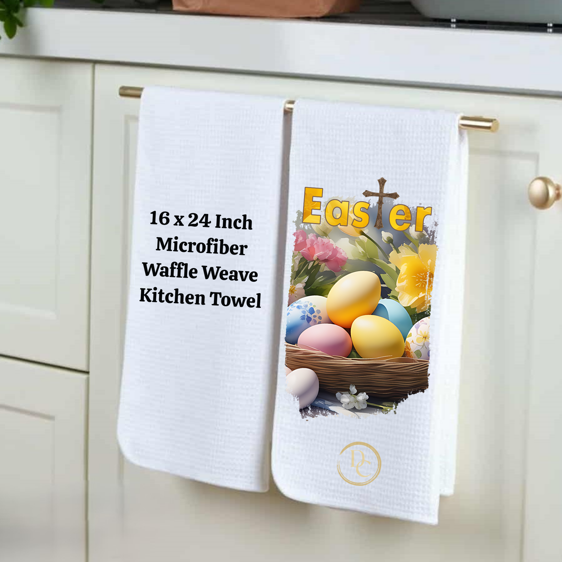 Two white kitchen towels hanging on a rack with Easter-themed designs and text.