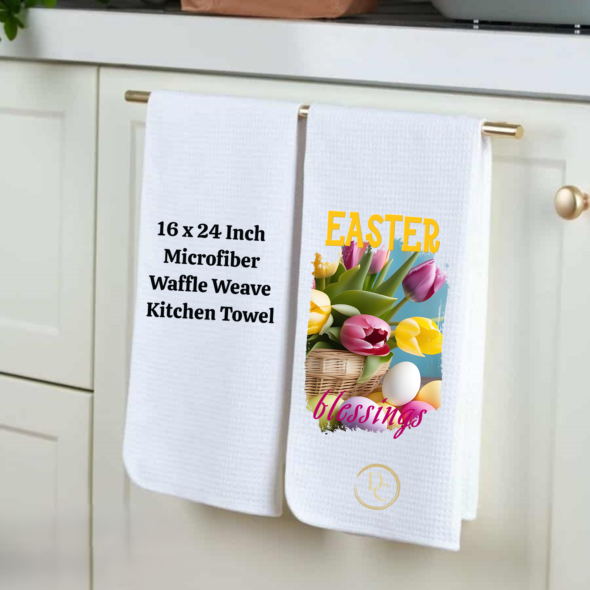Two kitchen towels hanging on a rack with one displaying Easter blessings text and graphics.