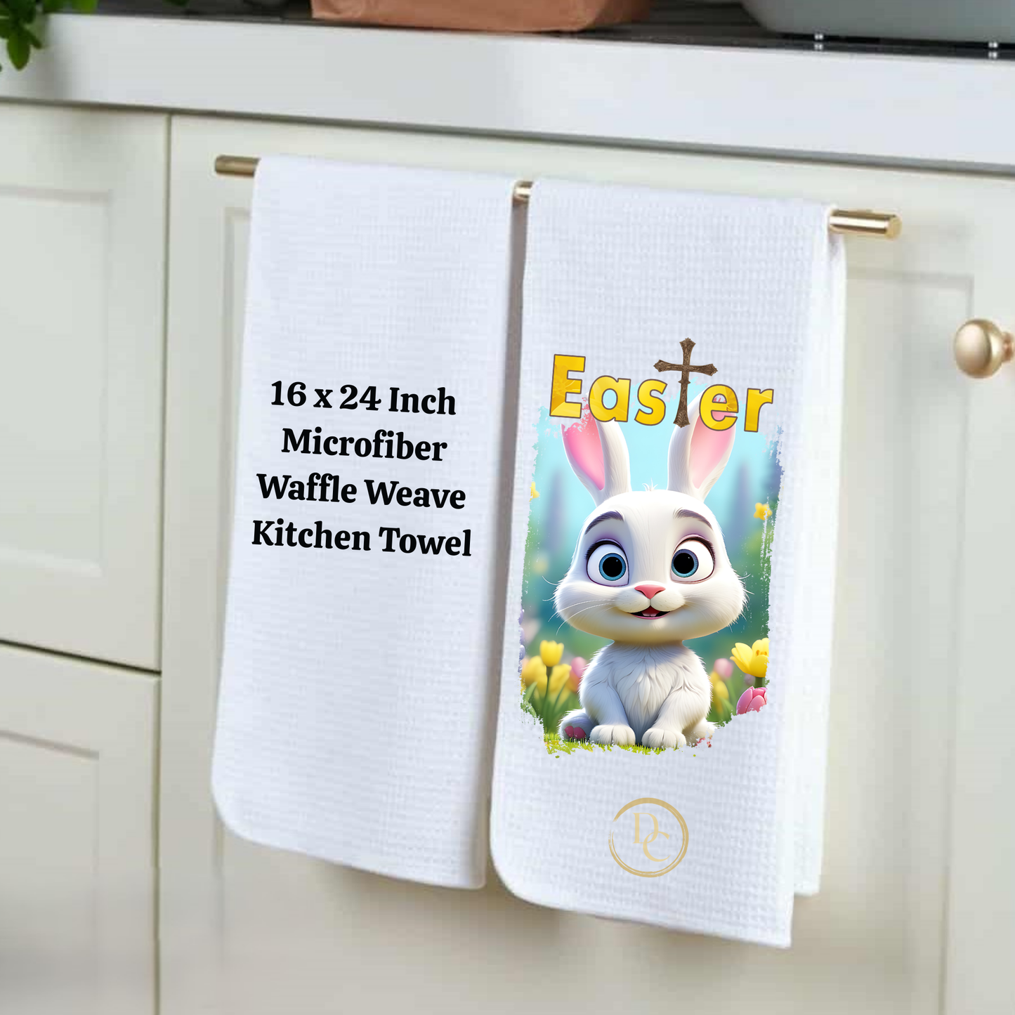 Two kitchen towels hanging on a rack, one with text and the other with an Easter design featuring a rabbit.
