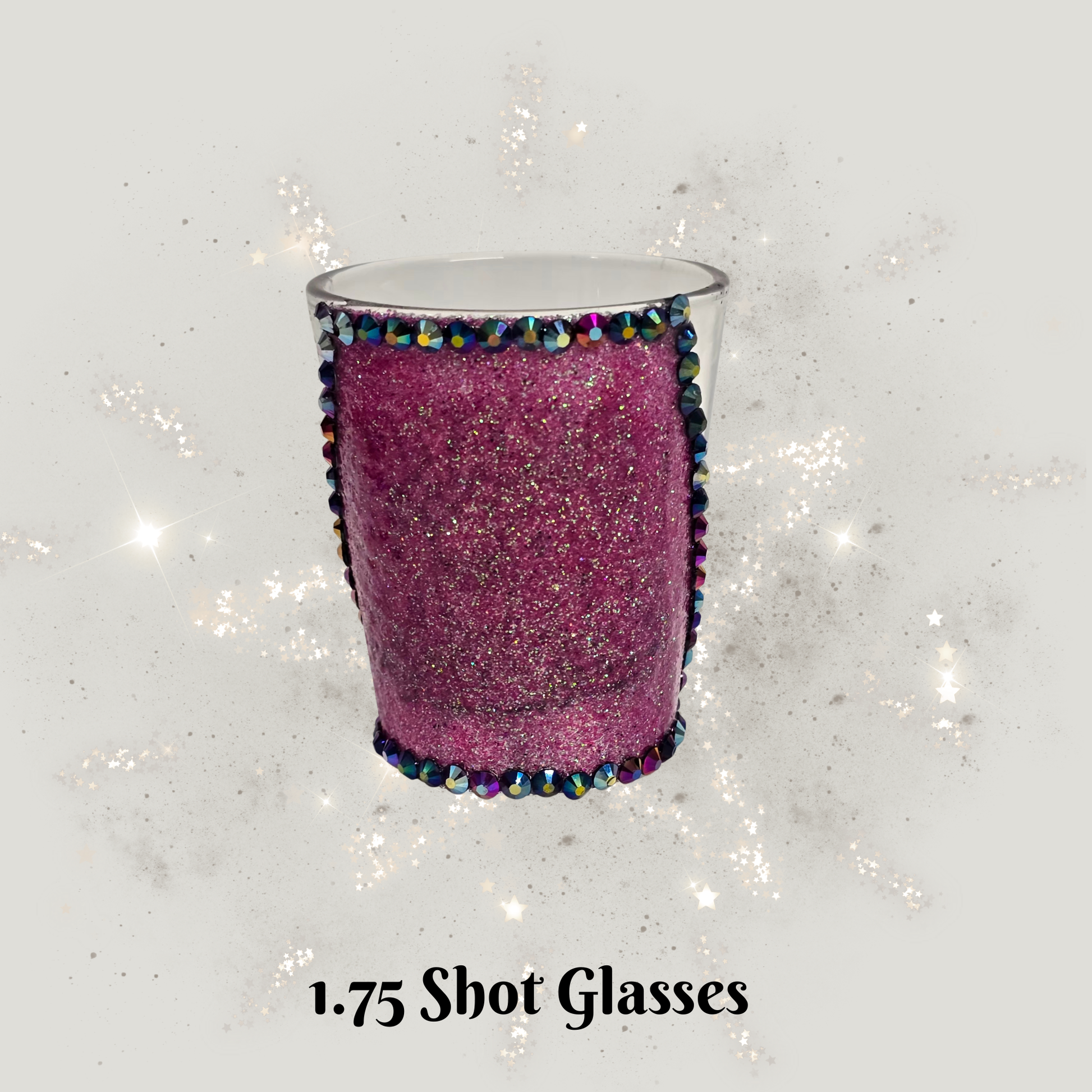 Pink glittery shot glass with decorative rim on a sparkly gray background