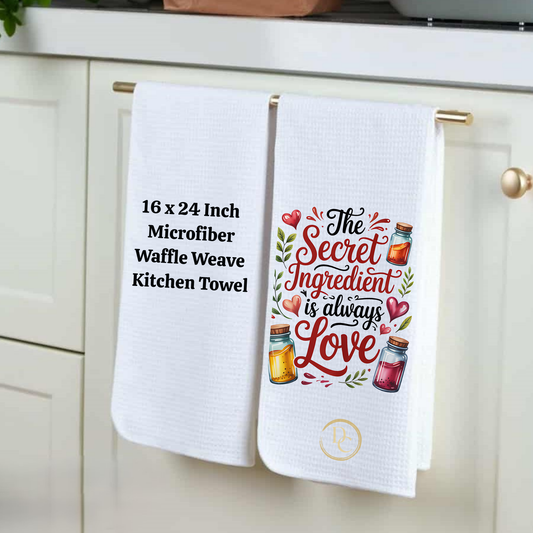 Two kitchen towels hanging on a rack with text and graphics.