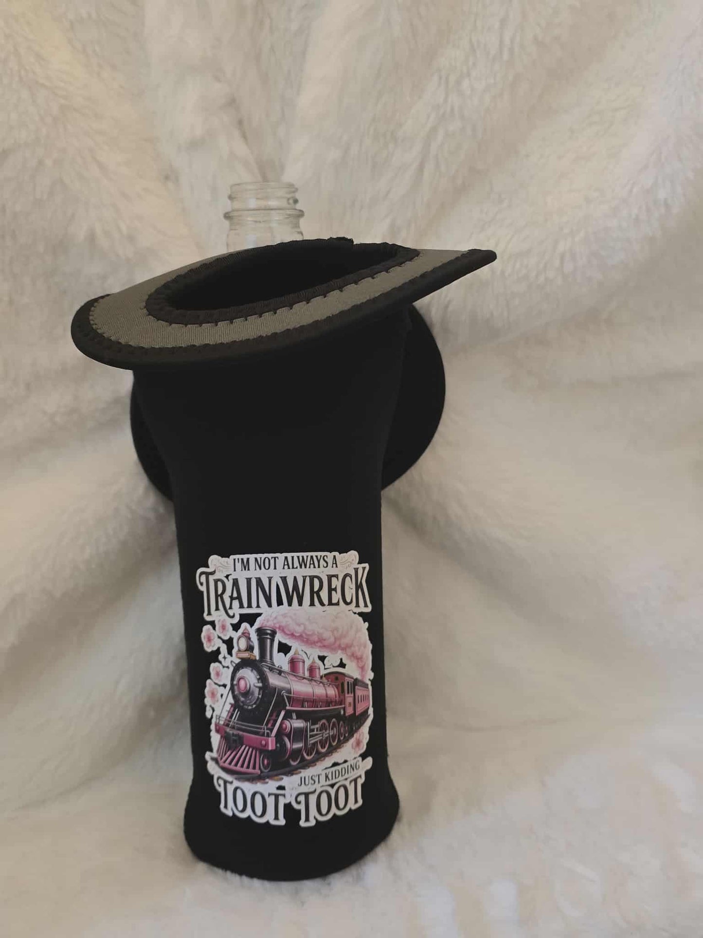 Black bottle holder with a train-themed design on a white background