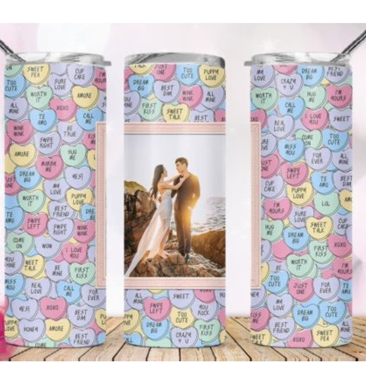 Tumbler with colorful heart pattern and a photo of a couple on a beach